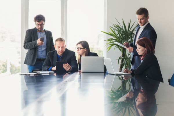 formal-people-with-gadgets-meeting